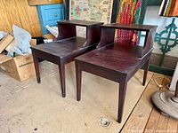 Front view of both matching mahogany step side tables