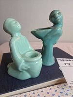 Both Weller turquoise figurine vases front view
