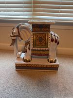 Full side view of porcelain elephant garden stool