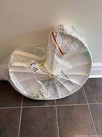 Front view of sealed 24-inch white plastic Lazy Susan insert