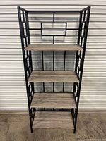 Full view of bookcase front showing all five shelves and frame