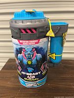 Front view of sealed MrBeast Lab Mutation Chamber Playset showing graphics and attached side tube