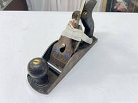 Top angled view showing complete plane with wooden knob, tote, lever cap marked Stanley