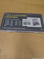 Closed plastic case showing product label "170PC U-CLIP & SCREW ASSORTMENT"
