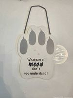 Front view showing paw shape, gray pads, text, chain