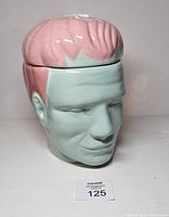 Front view of ceramic Frankenstein cookie jar with lid in place
