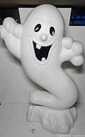 Front view of white ghost blow mold showing face and body