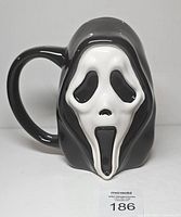 Front view of sculpted Ghost Face mug