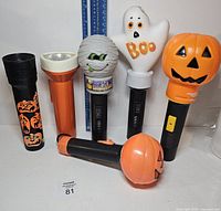 Group shot of all six Halloween flashlights upright