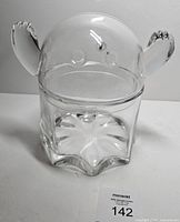 Front view of clear glass ghost candy bowl showing overall shape and lid