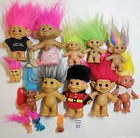 Group view of all troll dolls showing sizes, colours and outfits