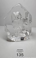 Front view of crystal owl sculpture showing relief and sticker