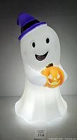 Front lit view of ghost blow mold showing overall design, hat and pumpkin