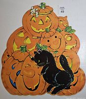 Full view of die-cut showing pumpkins, cat, mouse