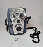 Front view showing flash reflector, lens, viewfinder and body colour