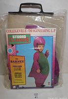 Front of sealed Barney costume package showing branding and product details