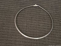 Necklace laid flat showing full shape and clasp