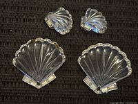 Two large and two small clear lucite shell jewellery pieces with rhinestone trim