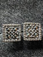 Front view of both square silver marcasite earrings