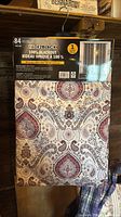 Front of packaged Fade2Black curtain panel showing branding and folded fabric