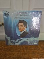 Front view of sealed LP showing artwork and shrink wrap