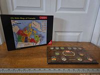Puzzle box and wooden plaque side by side for scale