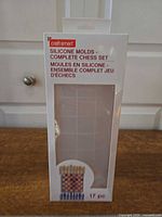 Front of Craft Smart Complete Chess Set silicone mold box showing brand, product name and window revealing grid board mold