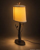 Full lamp lit showing shade, bronze base and cord