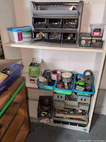 Shelf unit showing overall assortment of hardware and storage bins
