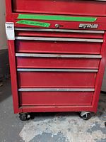 Front view of red Waterloo rolling tool cabinet showing drawers and casters