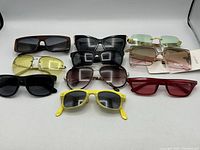 Nine sunglasses laid out for overview