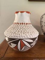 Full view of carved and painted Acoma vase