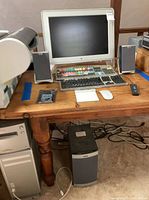 Overall view showing Apple Cinema Display, keyboards, speakers, Mac Pro tower and subwoofer
