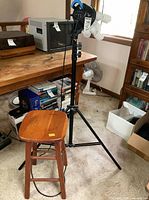 Light head on stand with stool in foreground