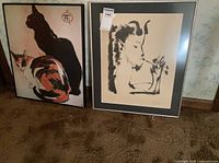 Both framed prints side by side on floor