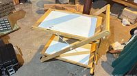 Overall view of folding two-tier wood and laminate cart