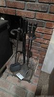Full view of fireplace tool set on stand