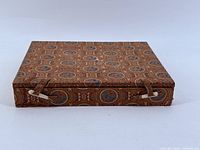 Closed patterned fabric box with tie closures