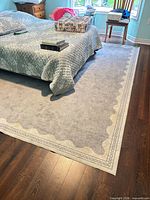 Rug placed under bed showing overall color and pattern