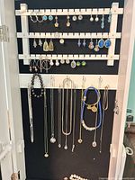 Main board showing necklaces, earrings racks and bead necklace