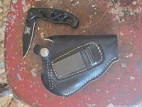 Knife and holster overview on tabletop