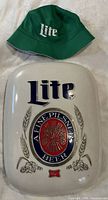 Front view of Miller Lite sign with bucket hat