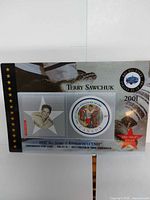 Front of stamp card showing star cutout portrait and round 47¢ stamp