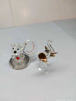 Elephant and bear glass figurines together for scale and overview