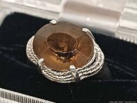 Front view showing citrine stone and rope bezel