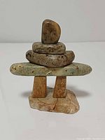 Front view of soapstone Inukshuk showing overall form and coloration