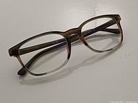 Front three-quarter view of Ray-Ban RB 5418 eyeglasses frame showing color gradient and lens shape