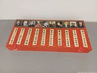 Closed red brocade case with portraits and title slips