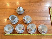 Entire set laid out with tape measure for scale