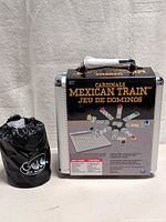 Mexican Train domino case and GOLO dice game pouch together